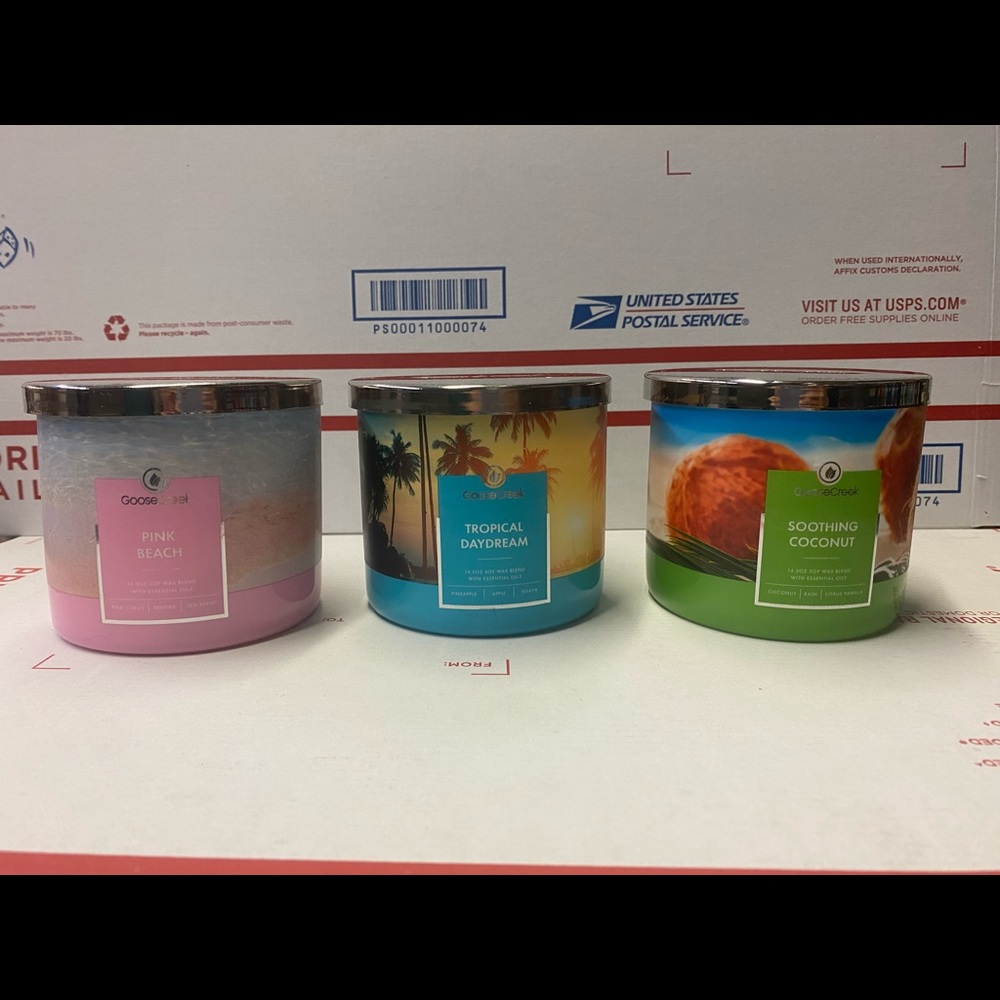 A set of Goose Creek Candles 3- wick